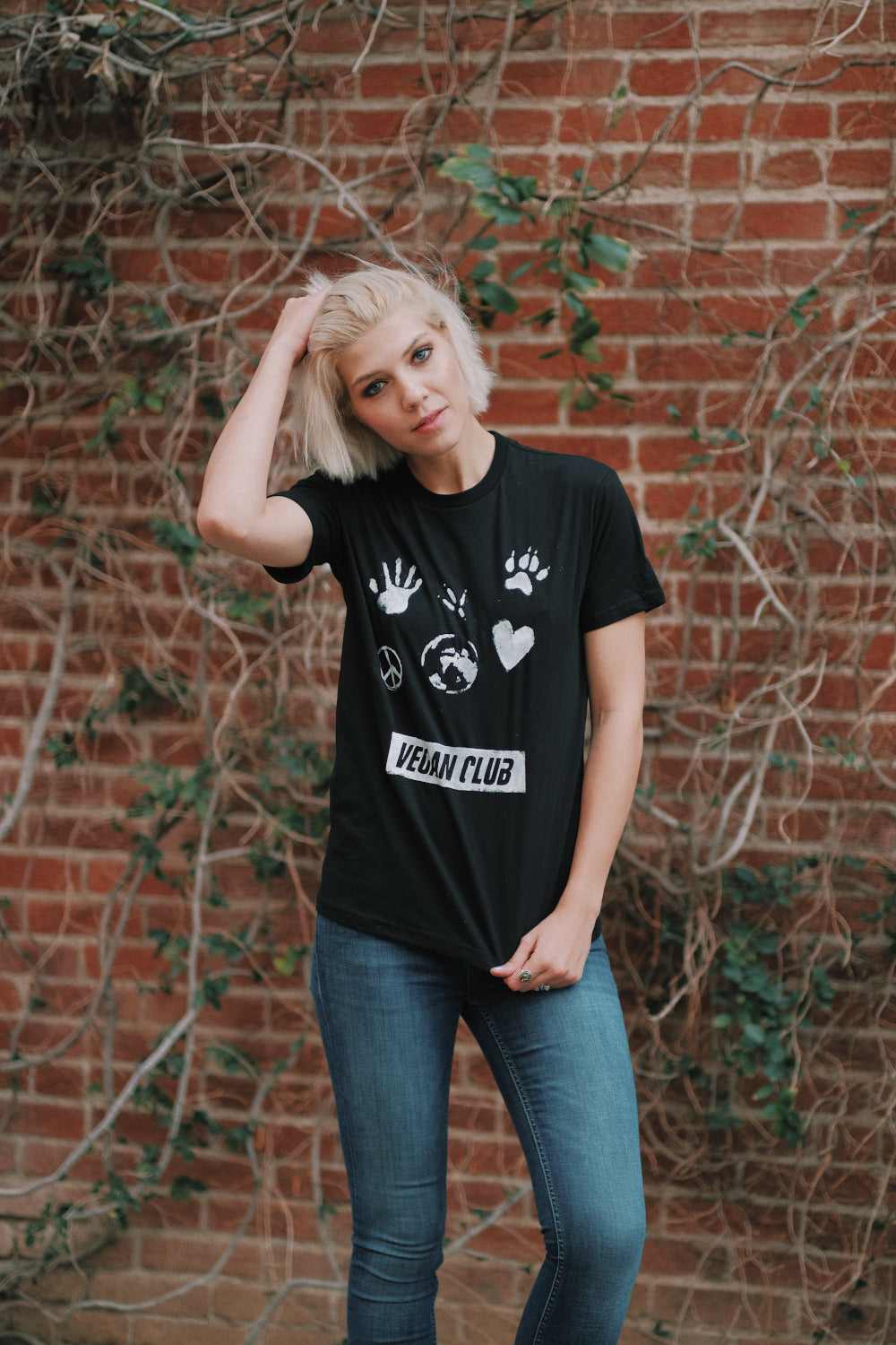 Vegan Club T-shirt feat. a paw, heart, hand, peace sign and Earth artwork by artist Brandi Jae