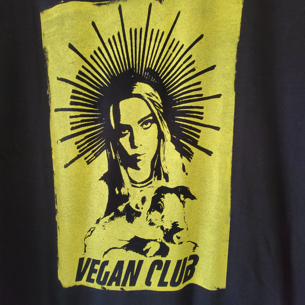 Billie Eilish Halo Vegan Club holding Pig T-shirt with large front design in yellow gold color