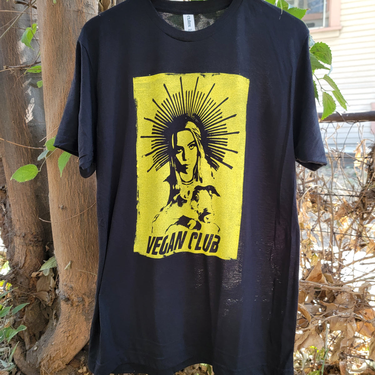 Billie Eilish Halo Vegan Club holding Pig T-shirt with large front design in yellow gold color