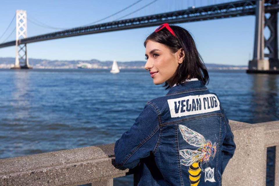 SOLD - Upcycled Jean Jacket Vest Vegan Club featuring a bee by artist Brandi Jae